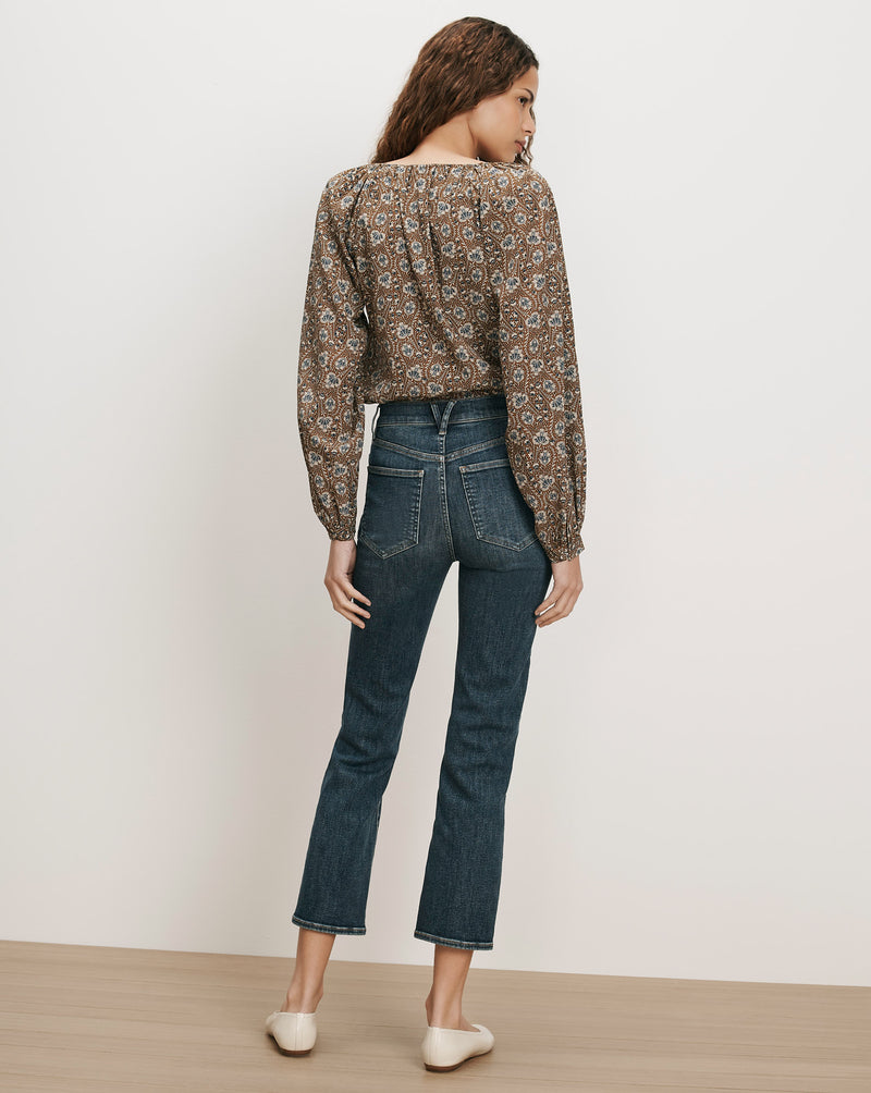 Veronica Beard Brown floral peasant blouse, dark wash flare jeans.