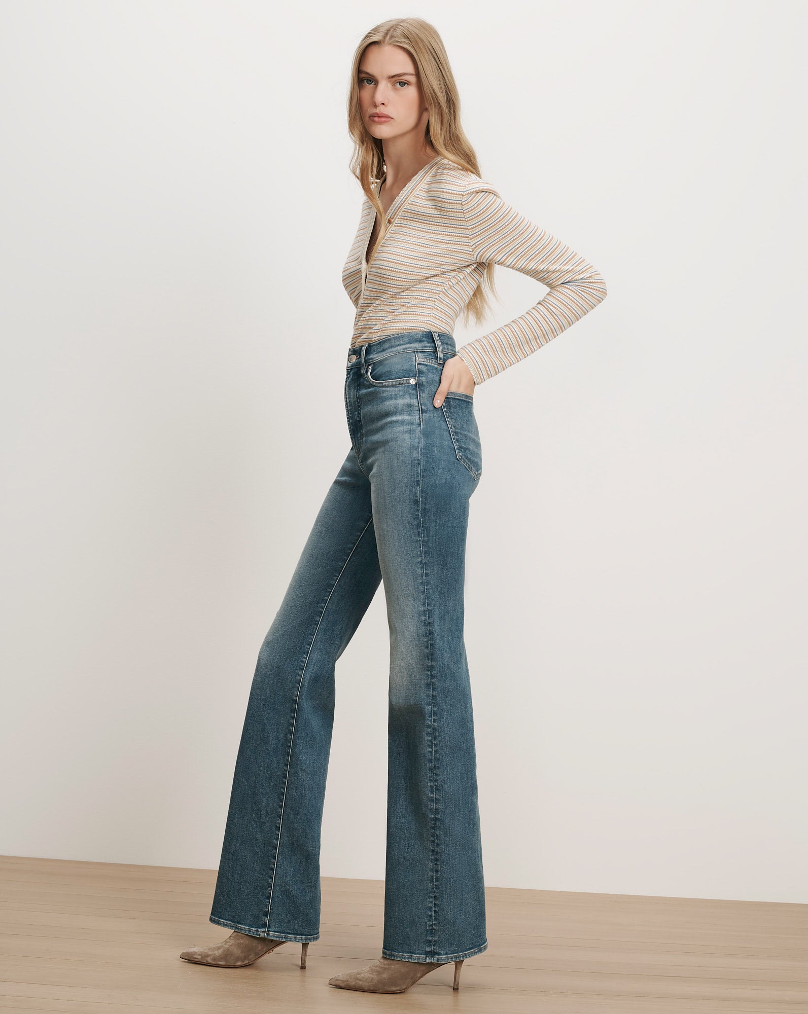 Veronica Beard Striped long-sleeve top and flared jeans.