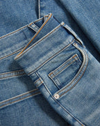 Veronica Beard Blue denim jeans with orange stitching.