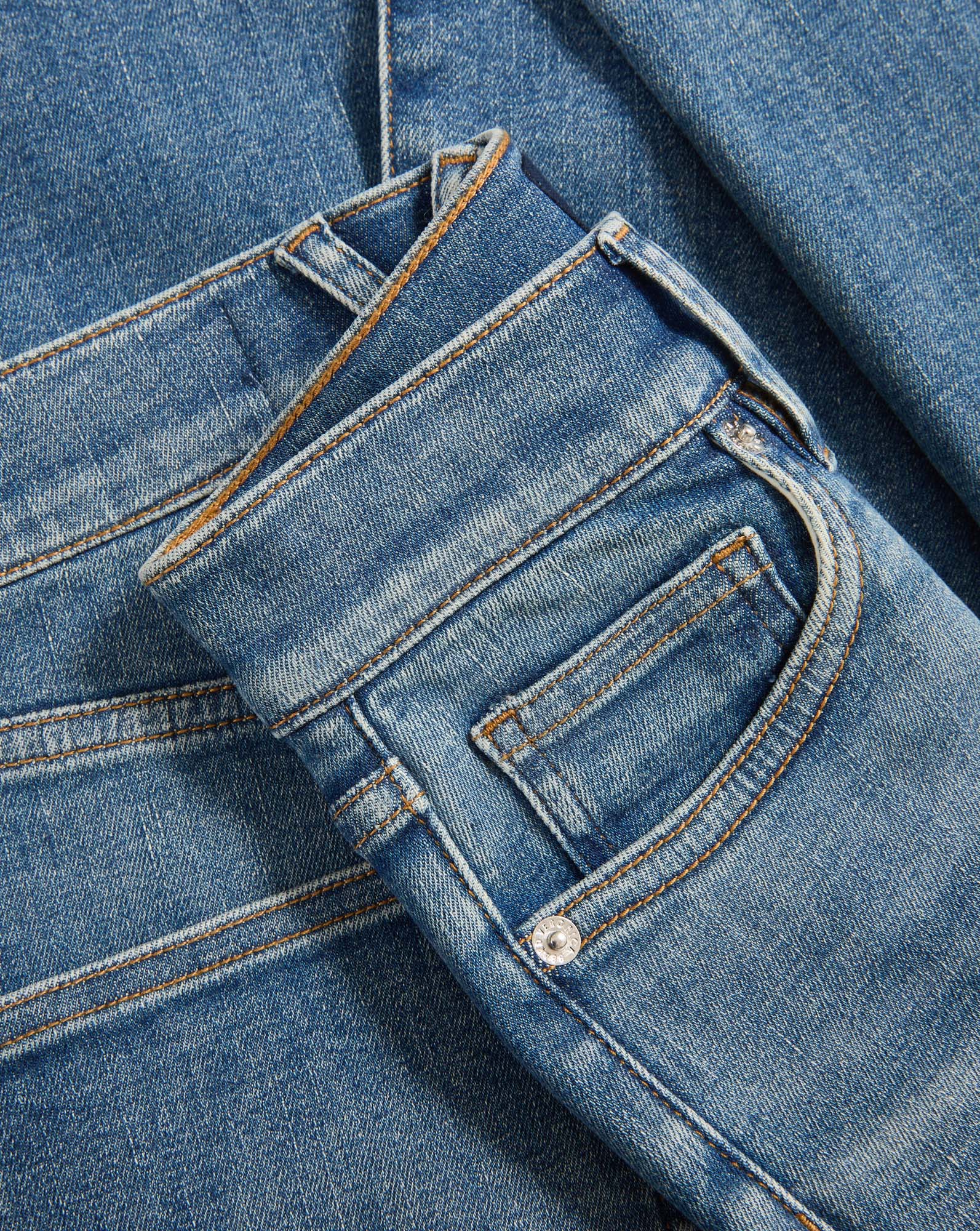 Veronica Beard Blue denim jeans with orange stitching.
