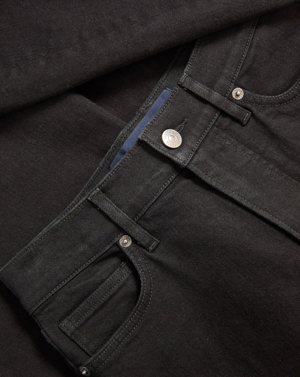 Veronica Beard Black denim jeans with silver button and rivets.