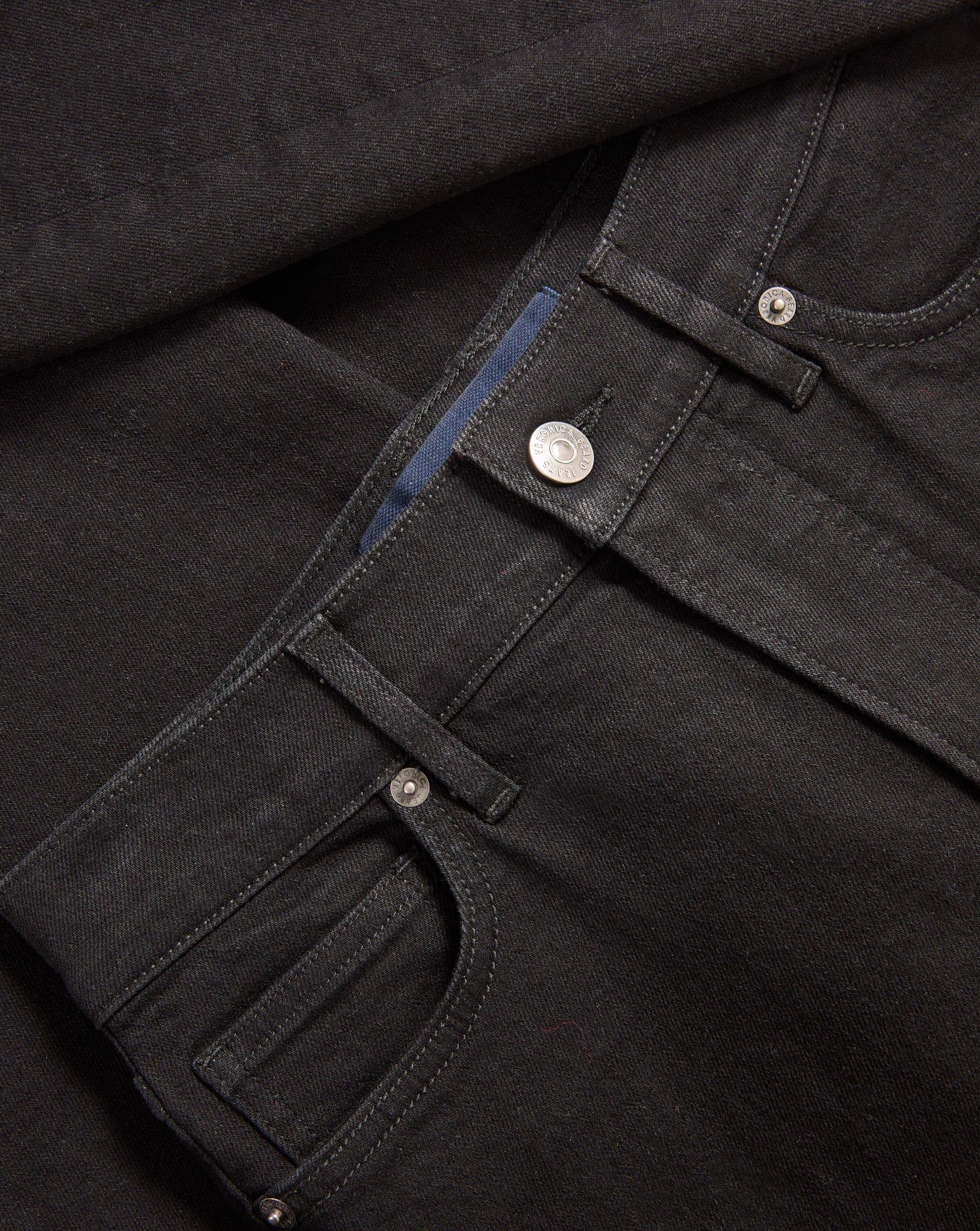 Veronica Beard Black denim jeans with silver button and rivets.