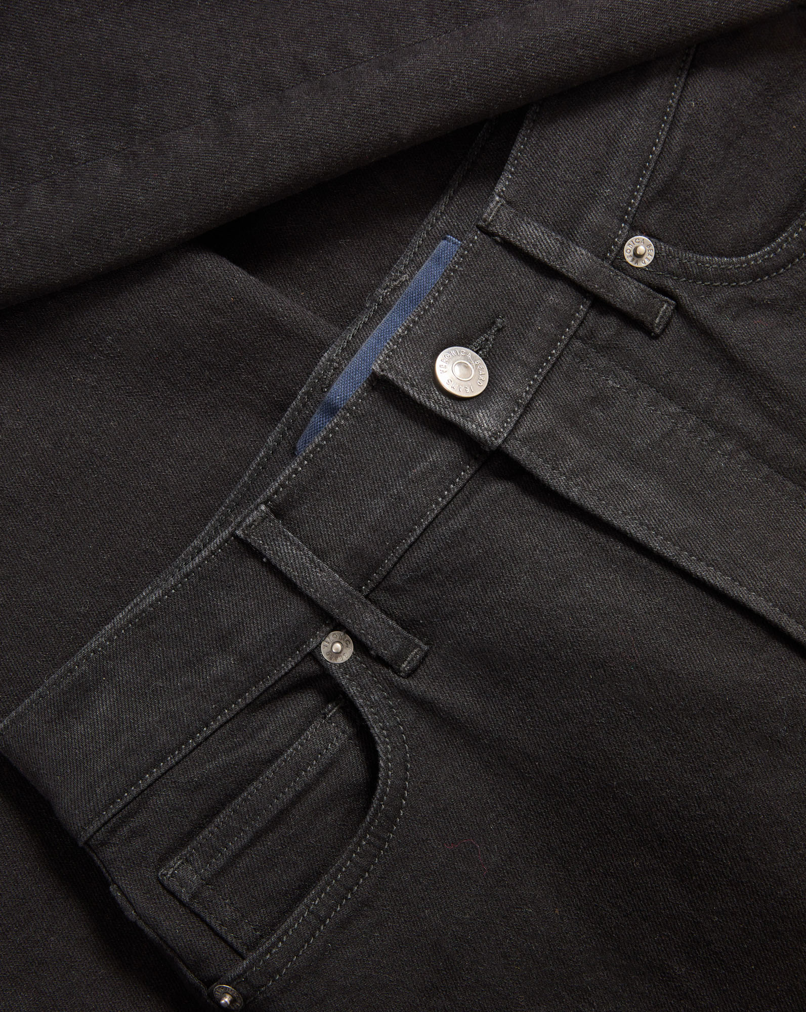 Veronica Beard Black denim jeans with silver button and rivets.