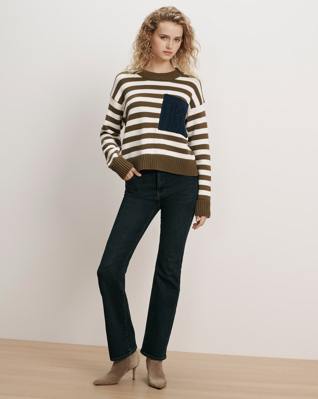 Veronica Beard Striped sweater with a navy knit pocket.
