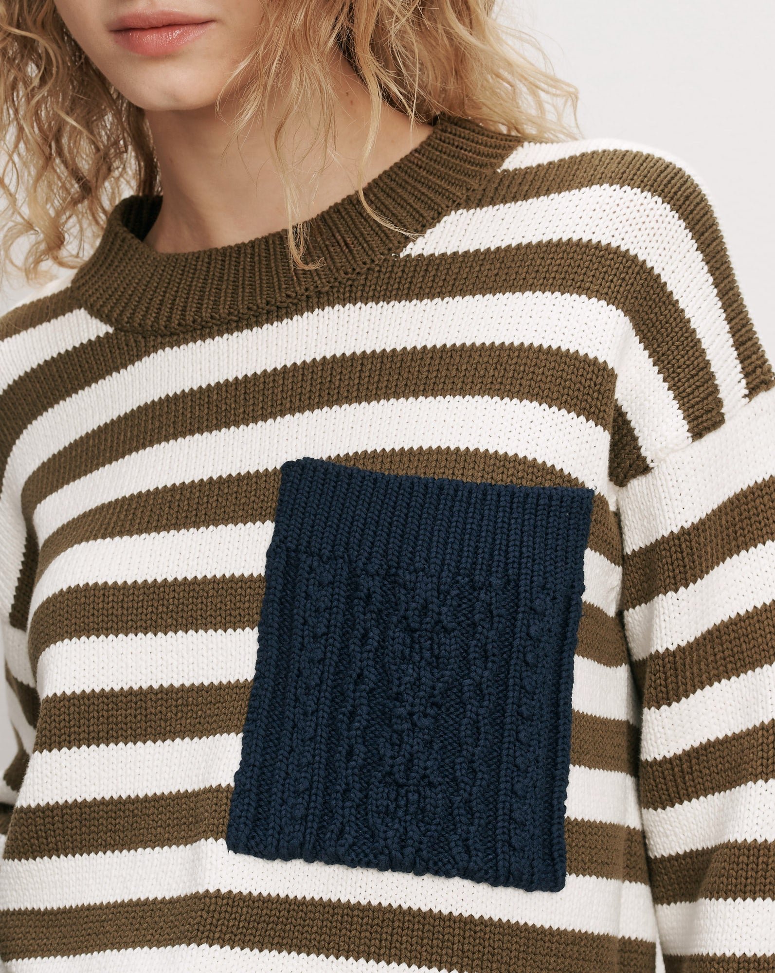 Veronica Beard Striped knit sweater with navy cable-knit pocket.