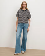 Veronica Beard Striped t-shirt with embroidered stars and wide-leg jeans.