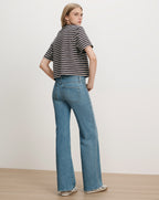 Veronica Beard Blue and white striped knit top and blue jeans.