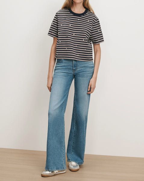 Veronica Beard Striped t-shirt with moon and star embroidery, blue jeans.