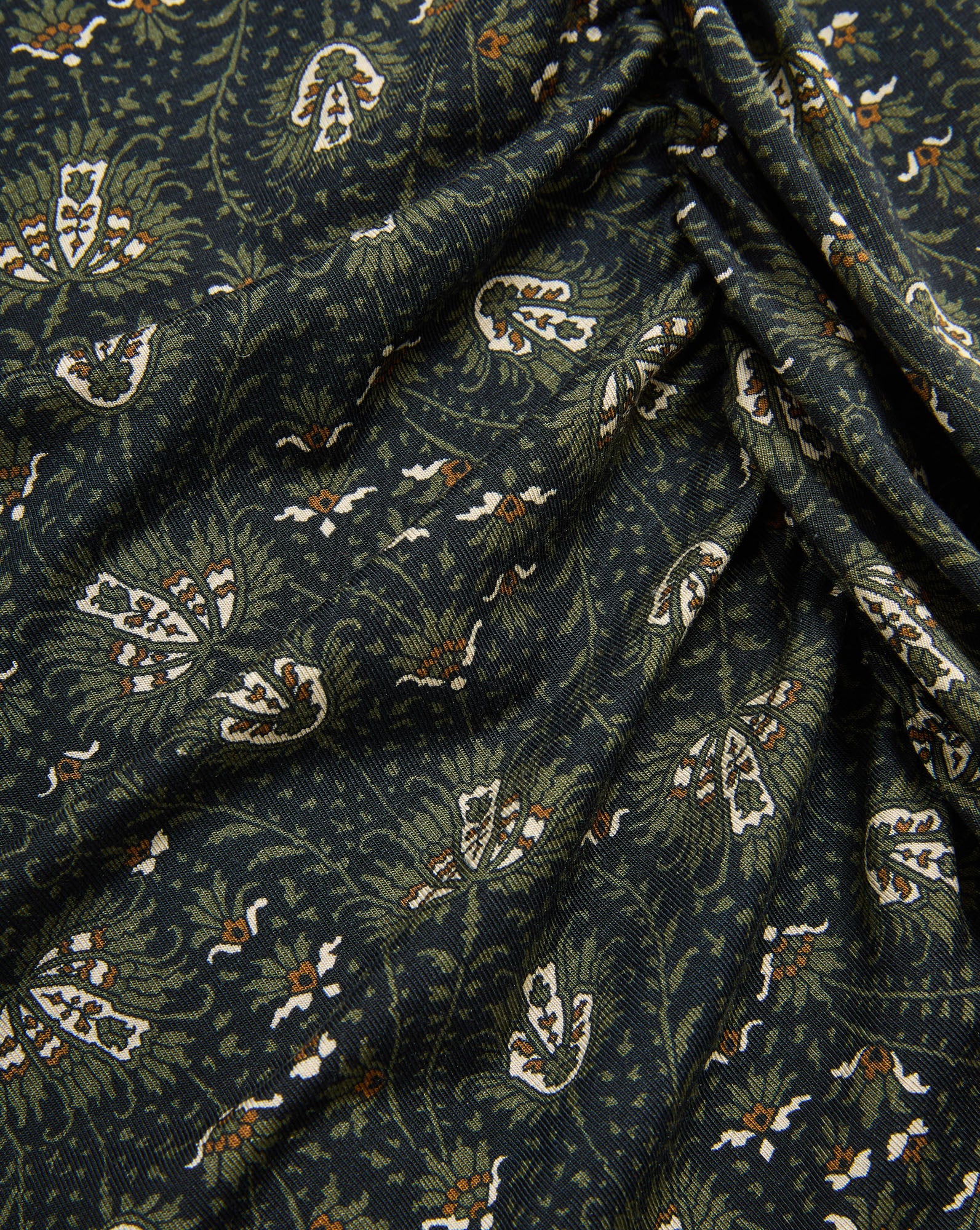 Veronica Beard Dark green patterned fabric with white and olive paisley.