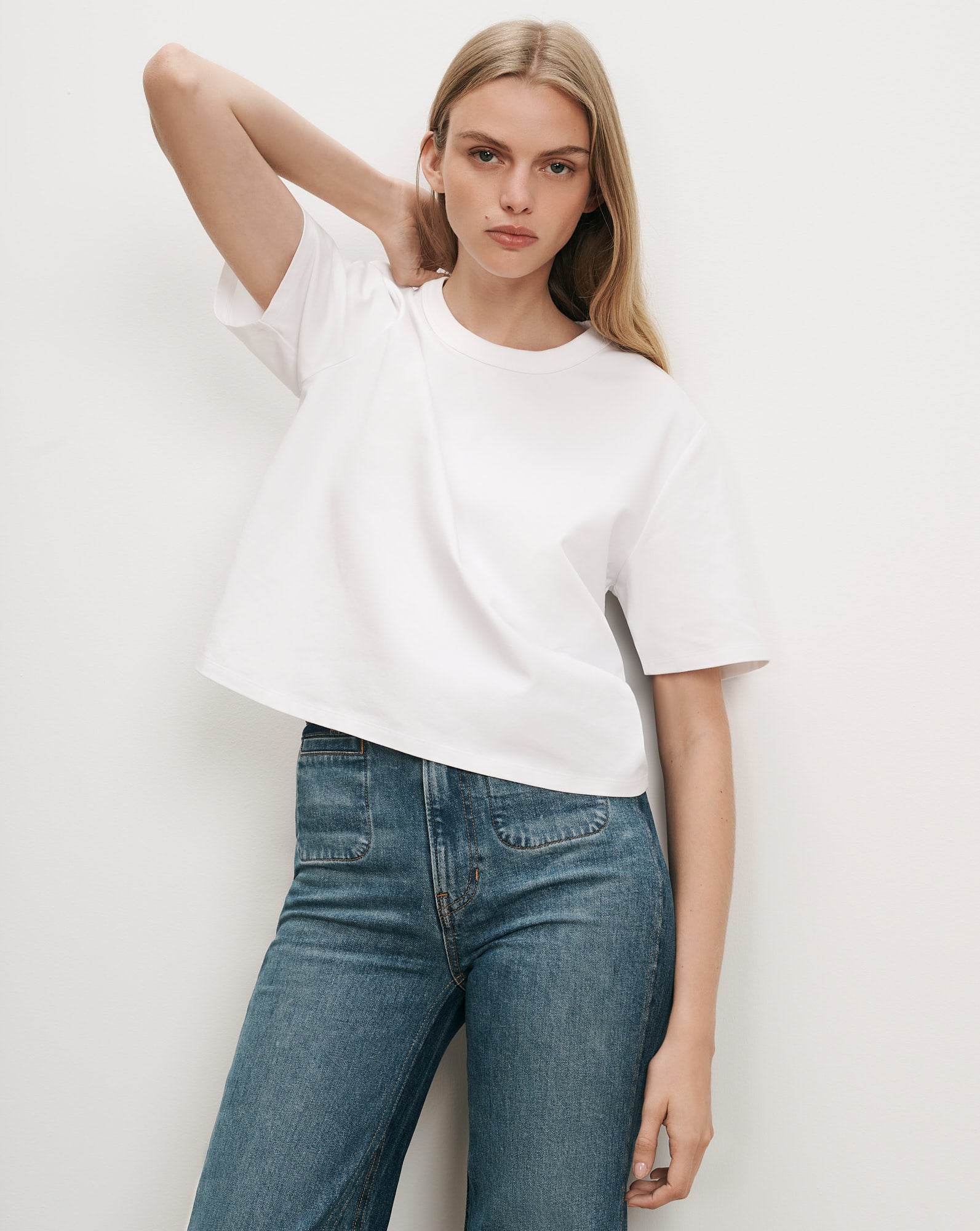 Veronica Beard White cotton crewneck t-shirt and blue jeans.