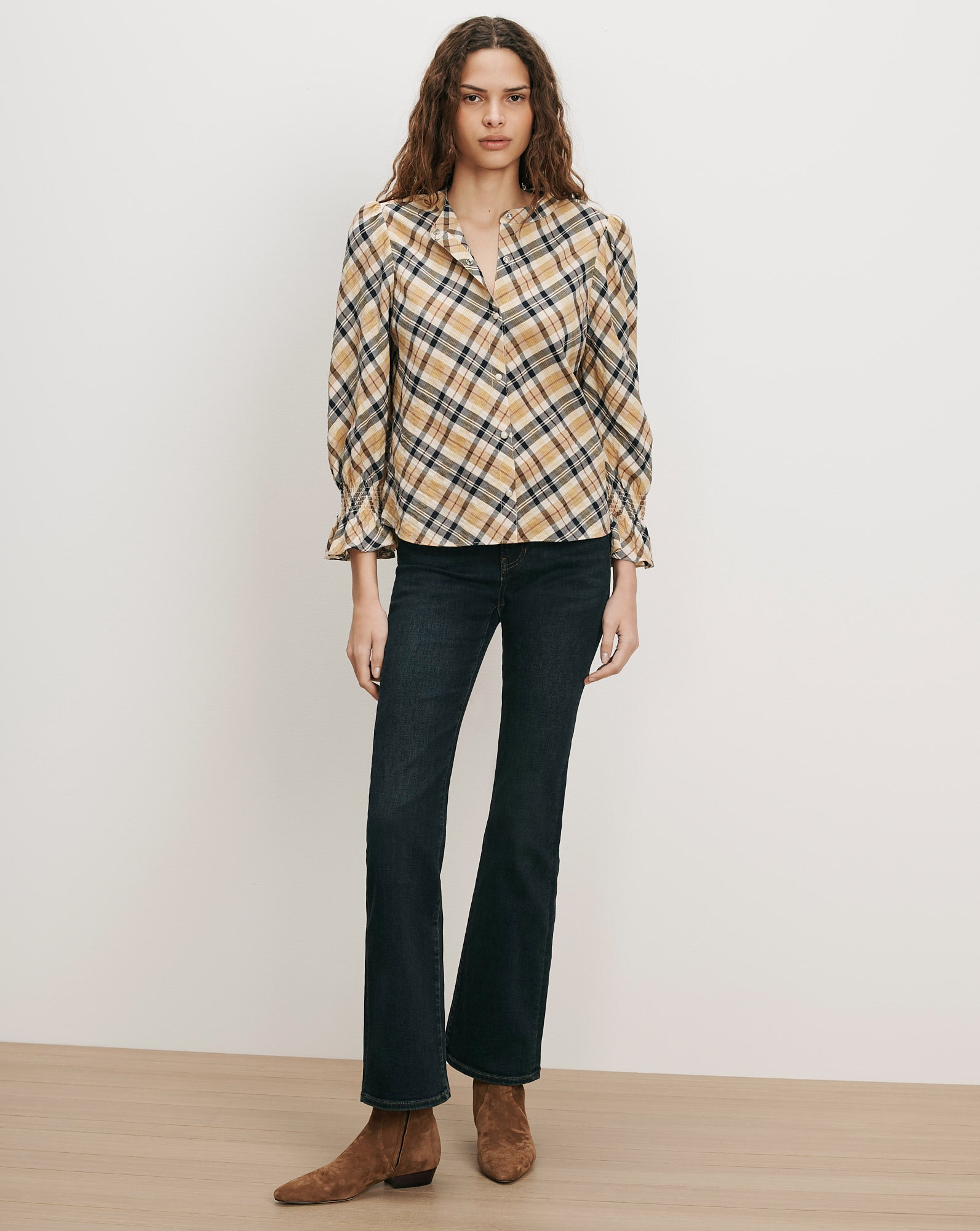 Veronica Beard Plaid long-sleeve blouse and dark wash flare jeans.