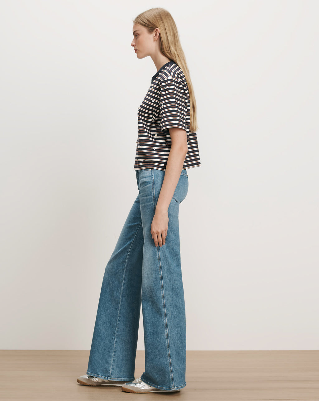Veronica Beard Navy striped knit tee and wide-leg jeans.