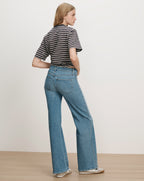Veronica Beard Blue denim flared jeans and striped t-shirt.