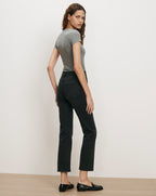 Veronica Beard Gray t-shirt, black jeans, black loafers.
