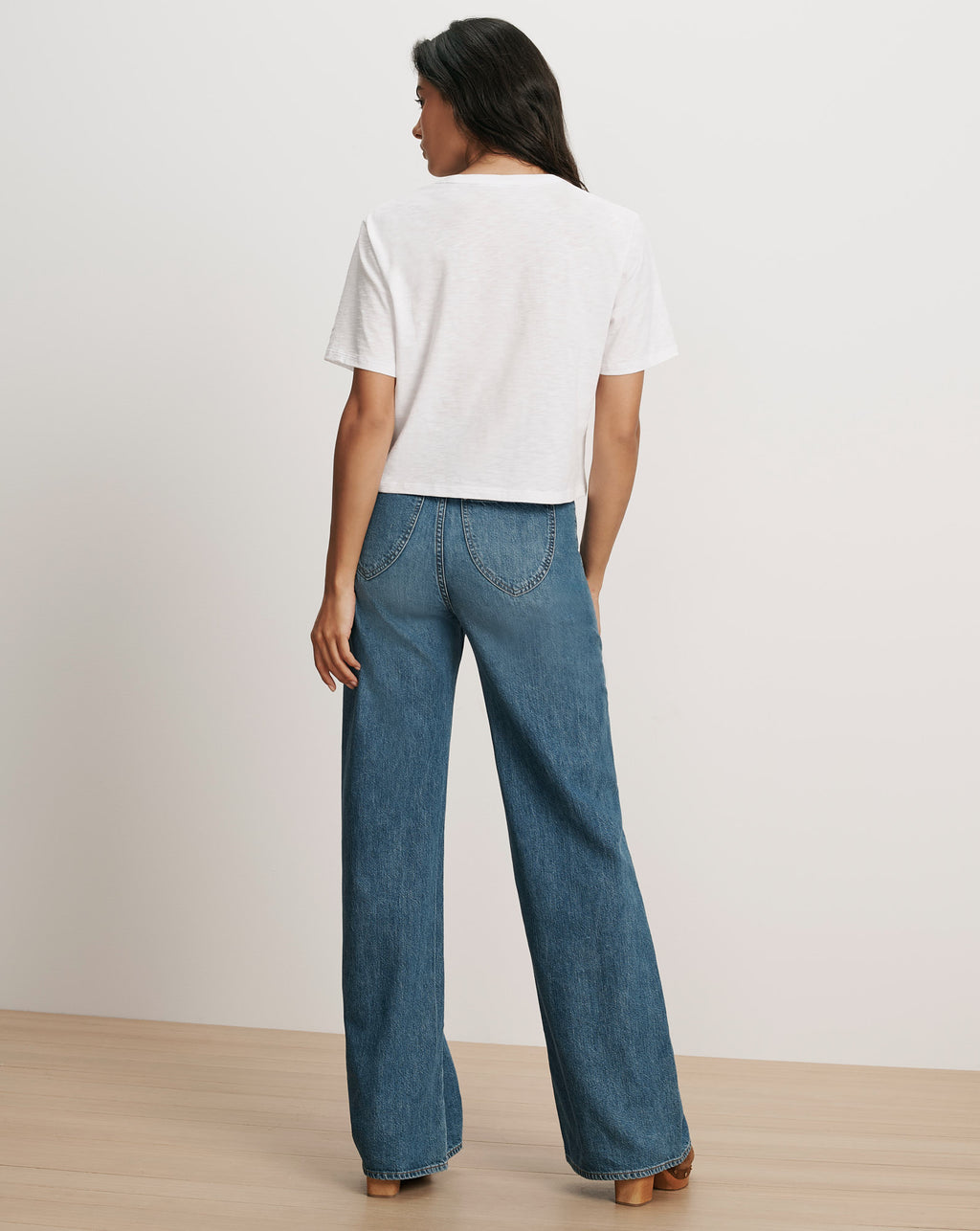 Veronica Beard White t-shirt, blue wide-leg jeans.