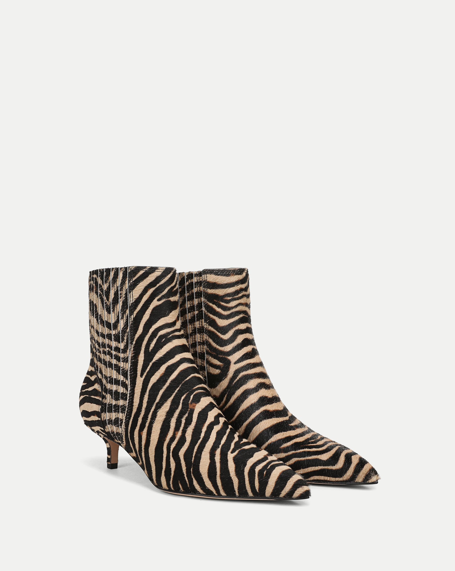 Veronica Beard Zebra print calf hair ankle boots with kitten heels.