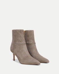 Veronica Beard Taupe suede ankle boots with whipstitch detailing.
