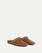 Veronica Beard Brown suede mules with gold buckle and red embellishments.