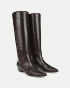 Veronica Beard Brown snakeskin knee-high boots with pointed toes.