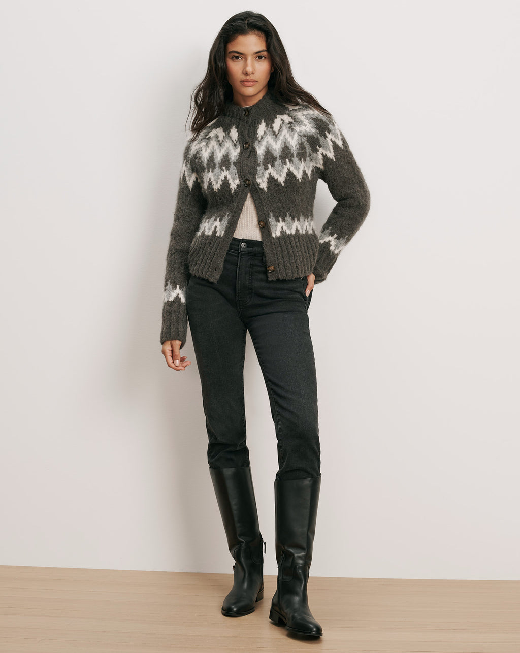 Veronica Beard Gray fair isle cardigan, black jeans, and black boots.