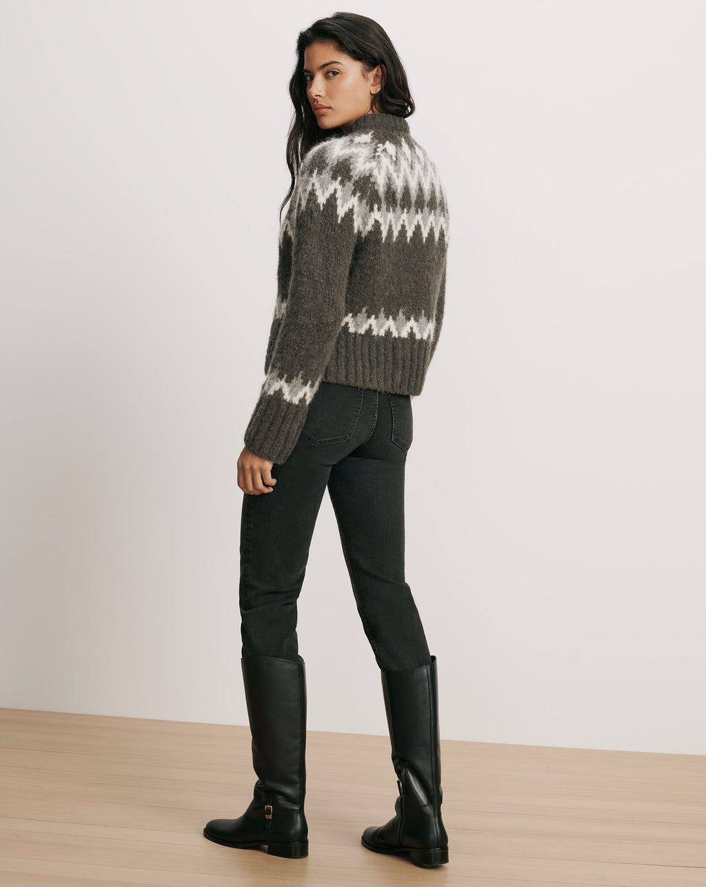 Veronica Beard Gray fair isle sweater, black jeans, black leather boots.