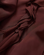Veronica Beard Burgundy chiffon blouse with ruffled detailing and button.