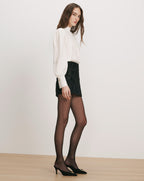 Veronica Beard White silk blouse, black sequin mini skirt.