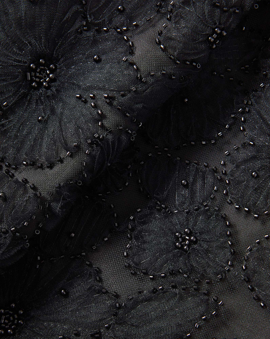 Veronica Beard Black beaded floral mesh fabric.