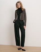 Veronica Beard Bronze sequin jacket, black turtleneck, black trousers, black heels.