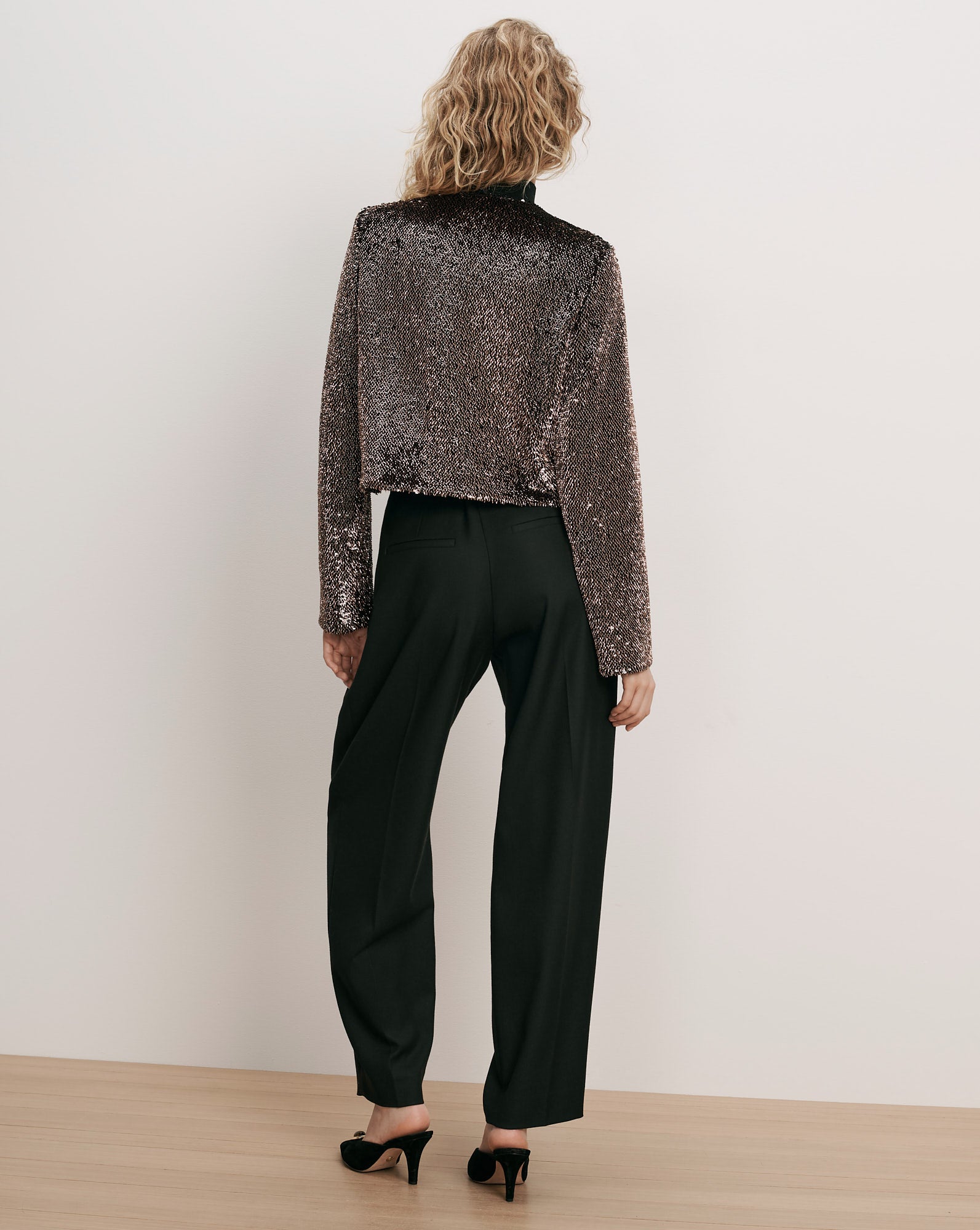 Veronica Beard Brown sequin cropped jacket and black trousers.