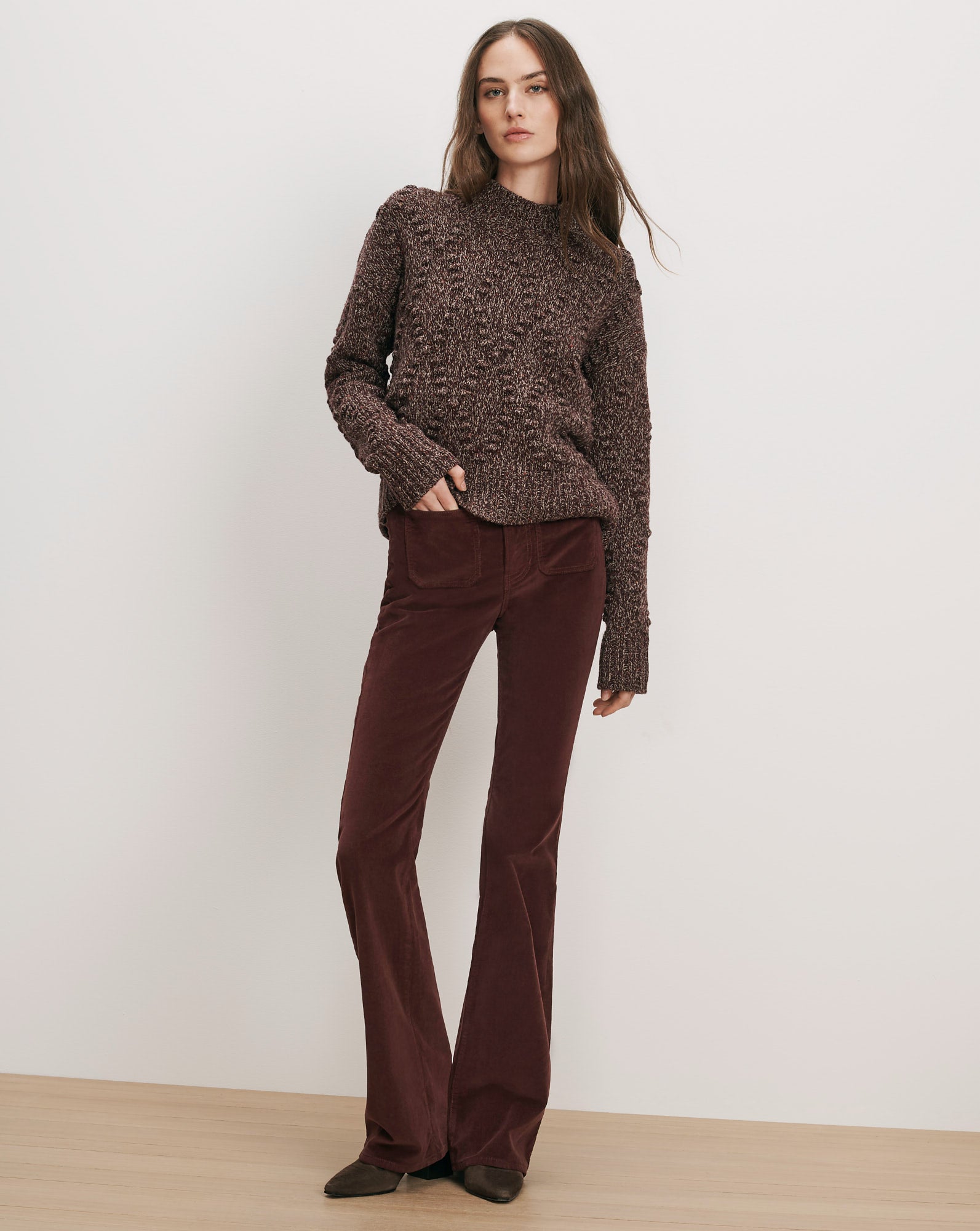 Veronica Beard Brown marled sweater and brown corduroy flare pants.