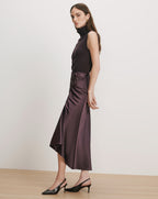 Veronica Beard Purple sleeveless turtleneck and satin midi skirt.