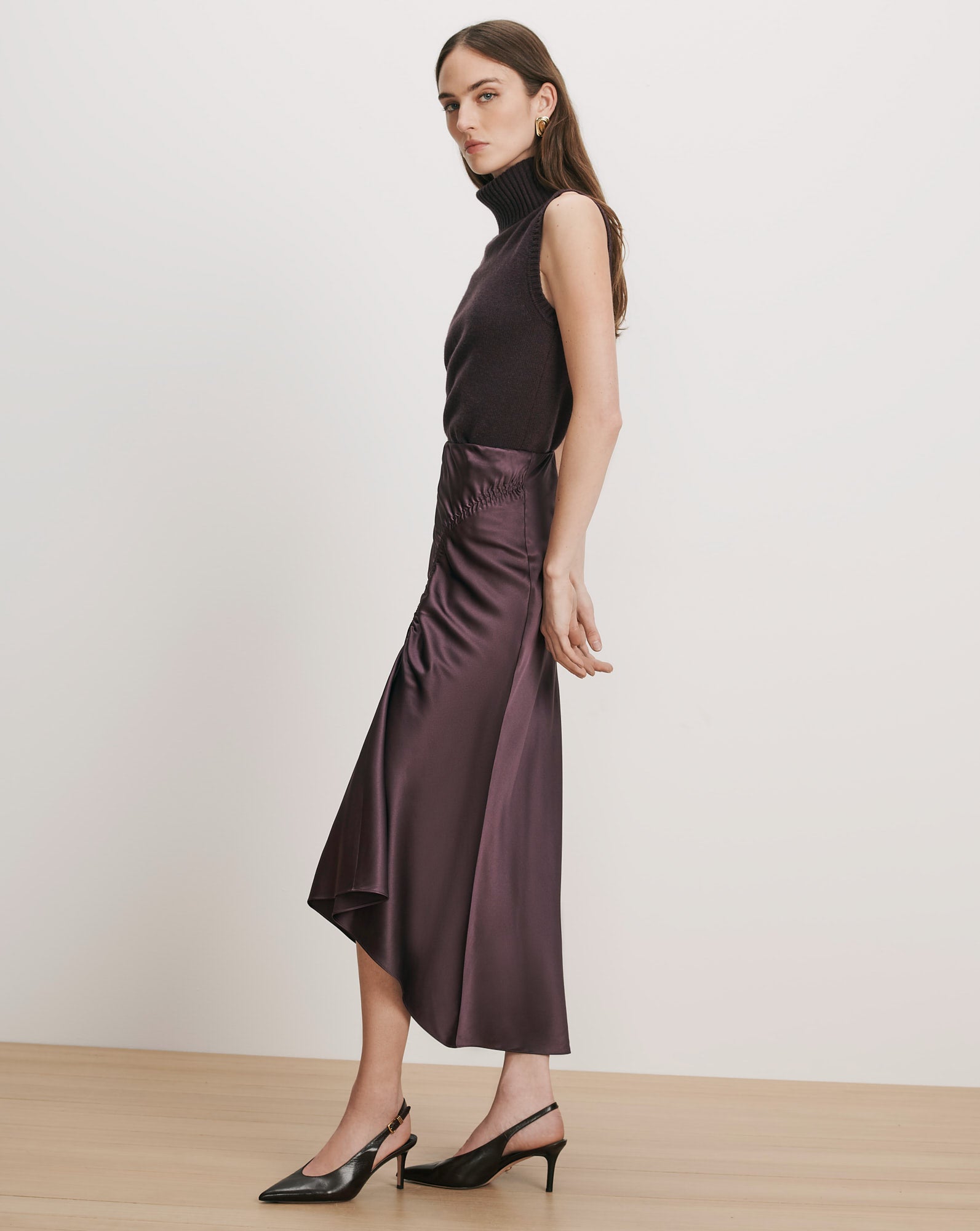 Veronica Beard Purple sleeveless turtleneck and satin midi skirt.