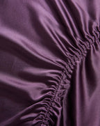 Veronica Beard Purple satin fabric with gathered elastic detailing.