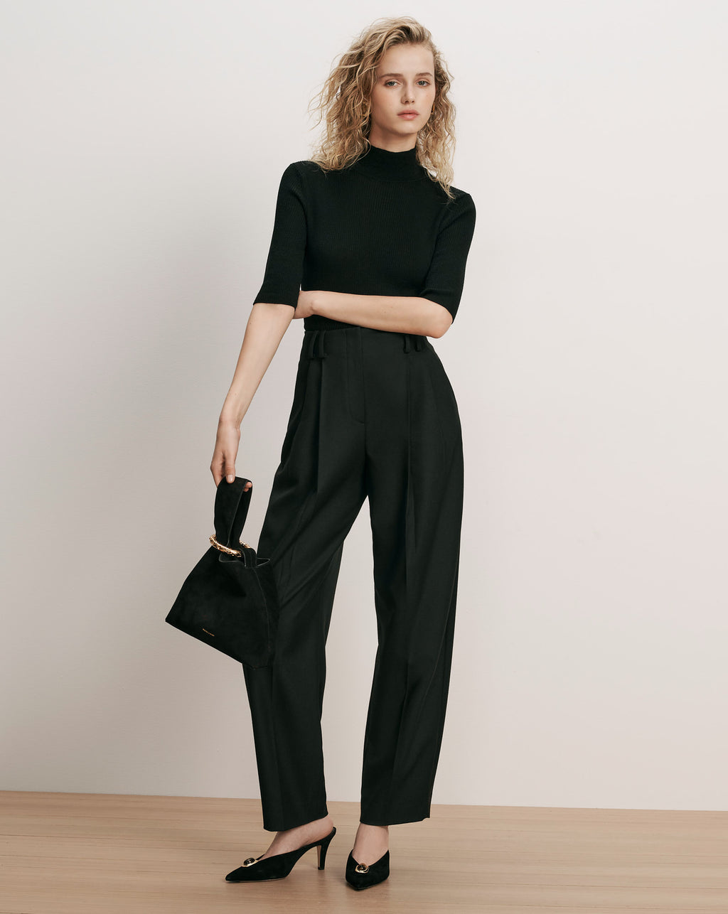 Veronica Beard Black ribbed mock neck top and pleated trousers