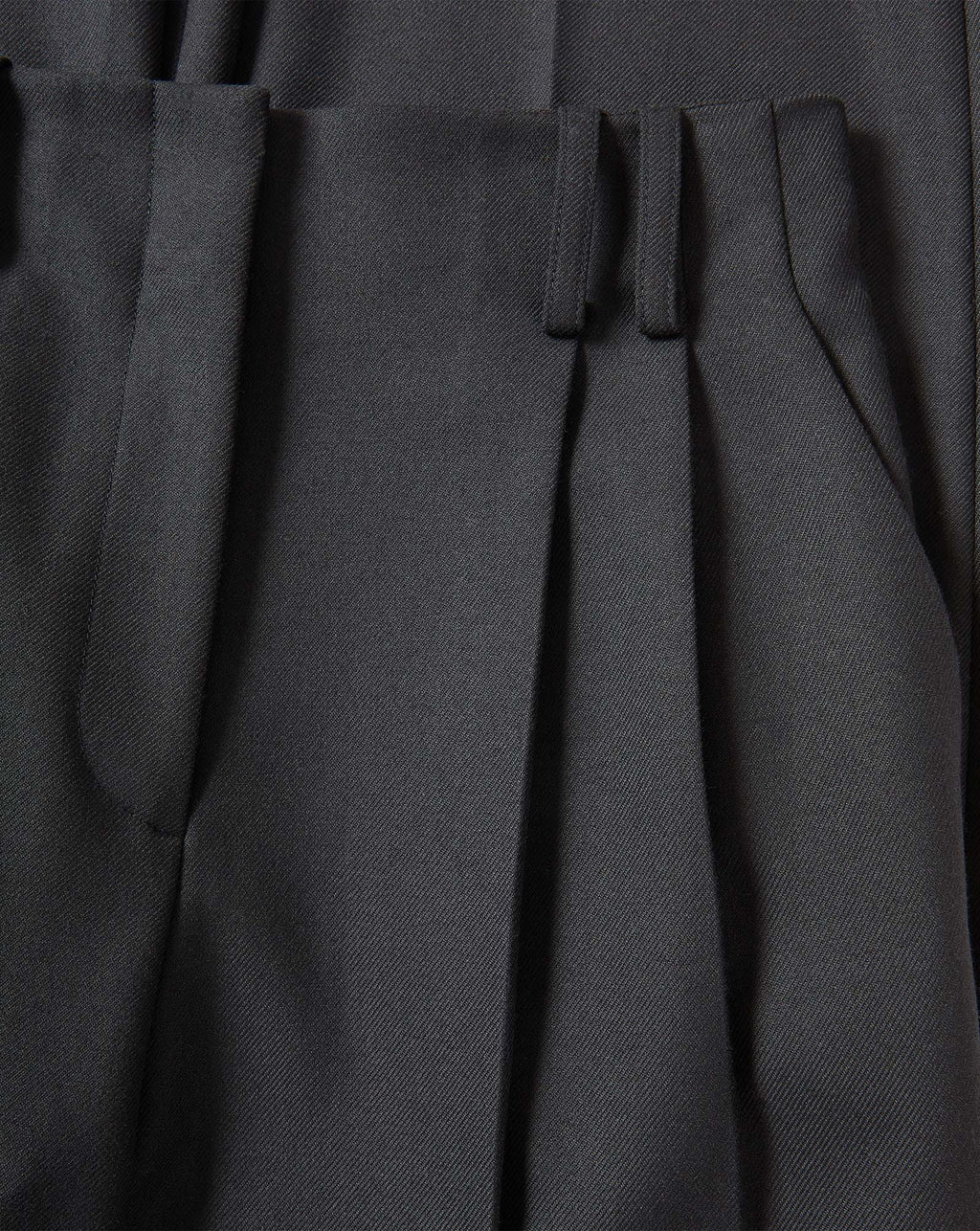 Veronica Beard Black pleated trousers in a woven fabric.