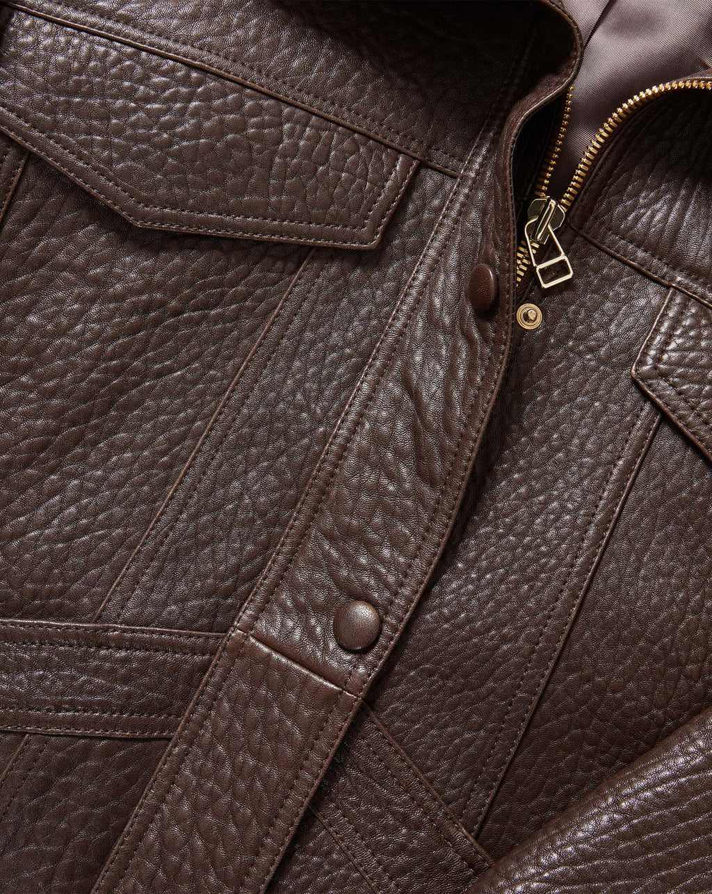 Veronica Beard Brown leather jacket with pockets and zipper.