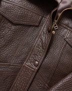 Veronica Beard Brown leather jacket with pockets and zipper.