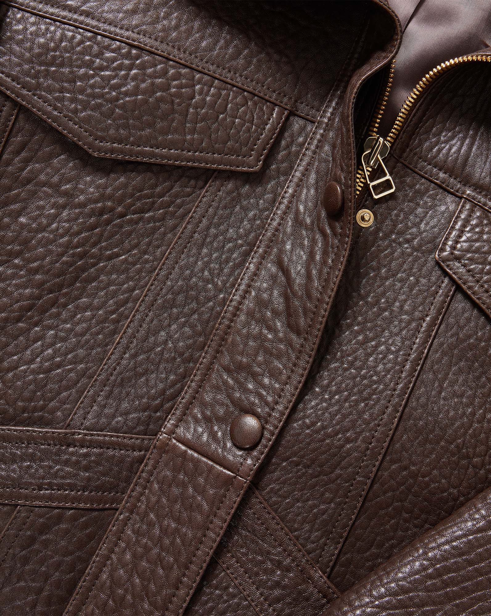 Veronica Beard Brown leather jacket with pockets and zipper.