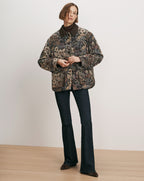 Veronica Beard Brown floral tapestry jacket with dark wash jeans.