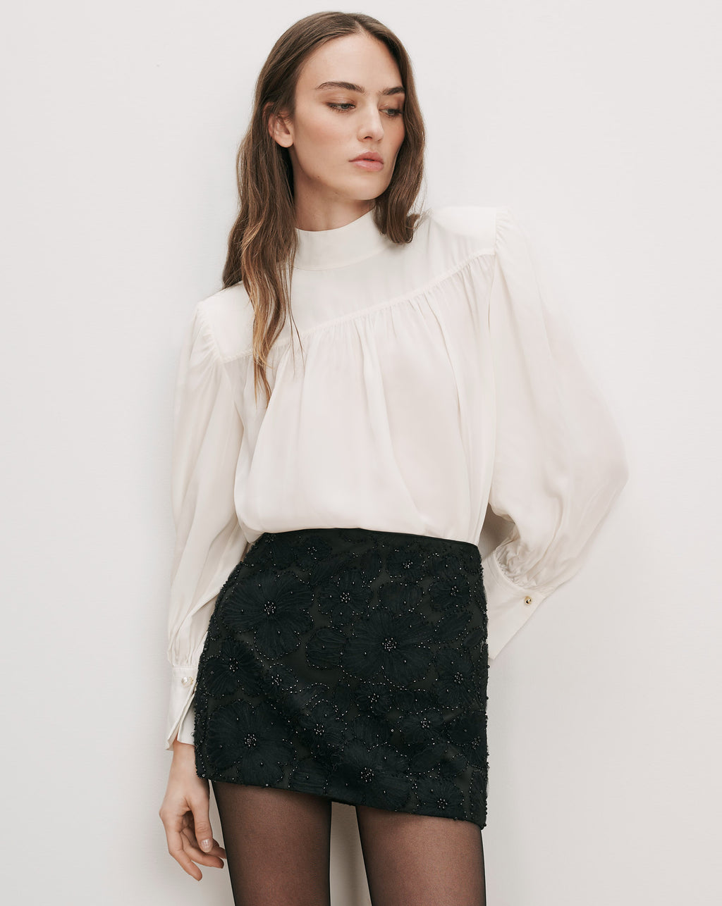 Veronica Beard White silk blouse, black embroidered mini skirt.