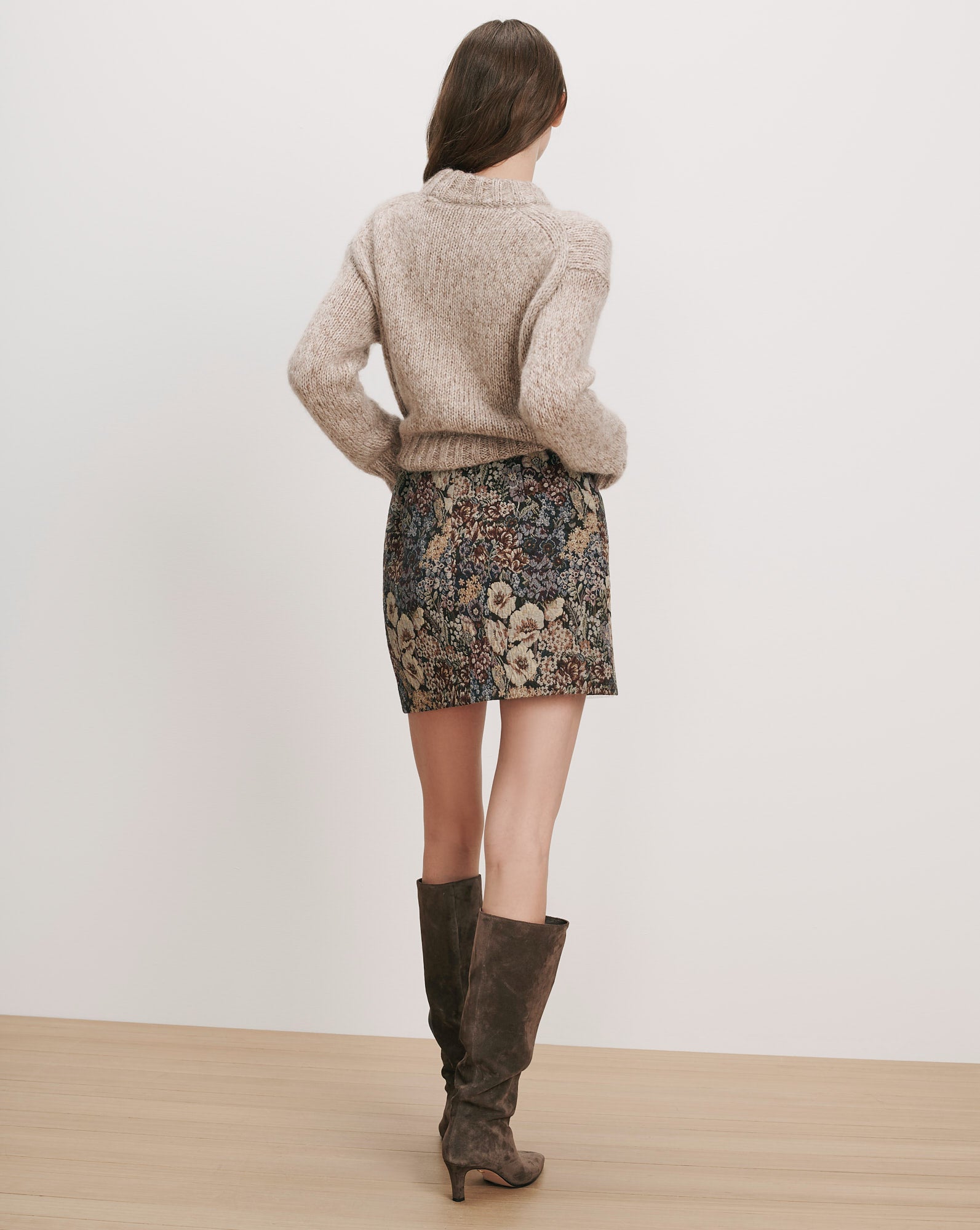Veronica Beard Beige knit sweater, floral mini skirt, brown suede boots.