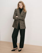 Veronica Beard Brown tweed blazer, black turtleneck, black trousers, black mules.
