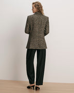 Veronica Beard Black and tan tweed blazer and black trousers.