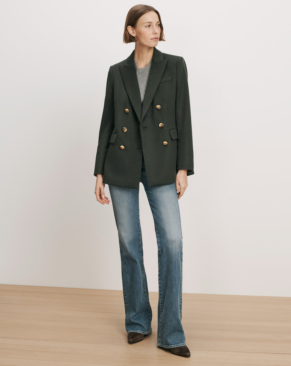 Veronica Beard Dark green double-breasted blazer with gold buttons.