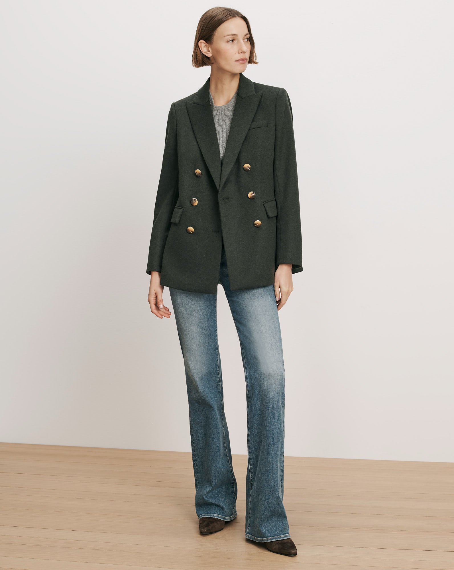 Veronica Beard Dark green double-breasted blazer with gold buttons.