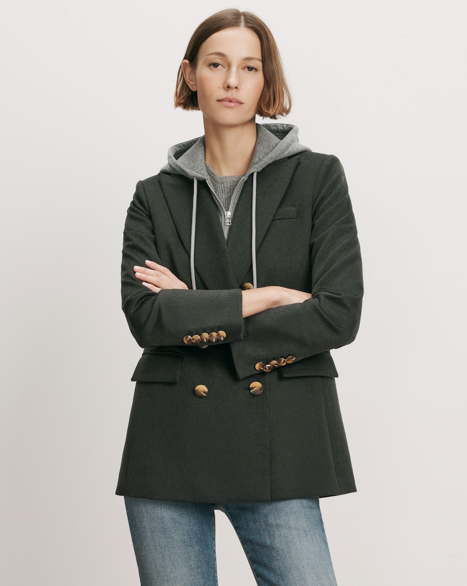 Veronica Beard Dark green double-breasted blazer with gold buttons.