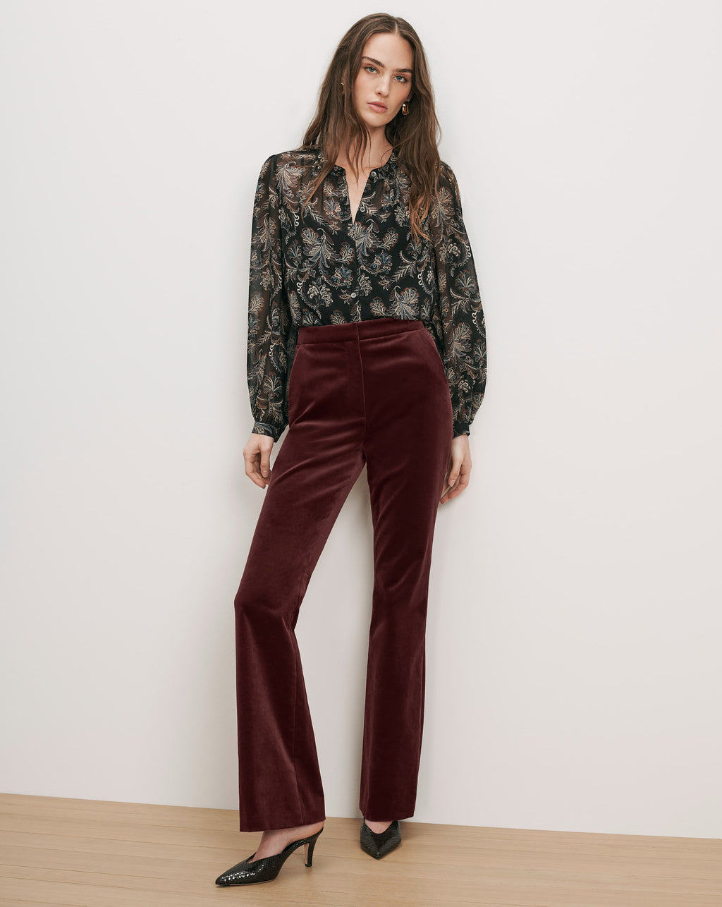 Veronica Beard Brown velvet flared pants and black sheer paisley blouse.