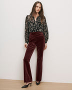 Veronica Beard Brown velvet flared pants and black sheer paisley blouse.