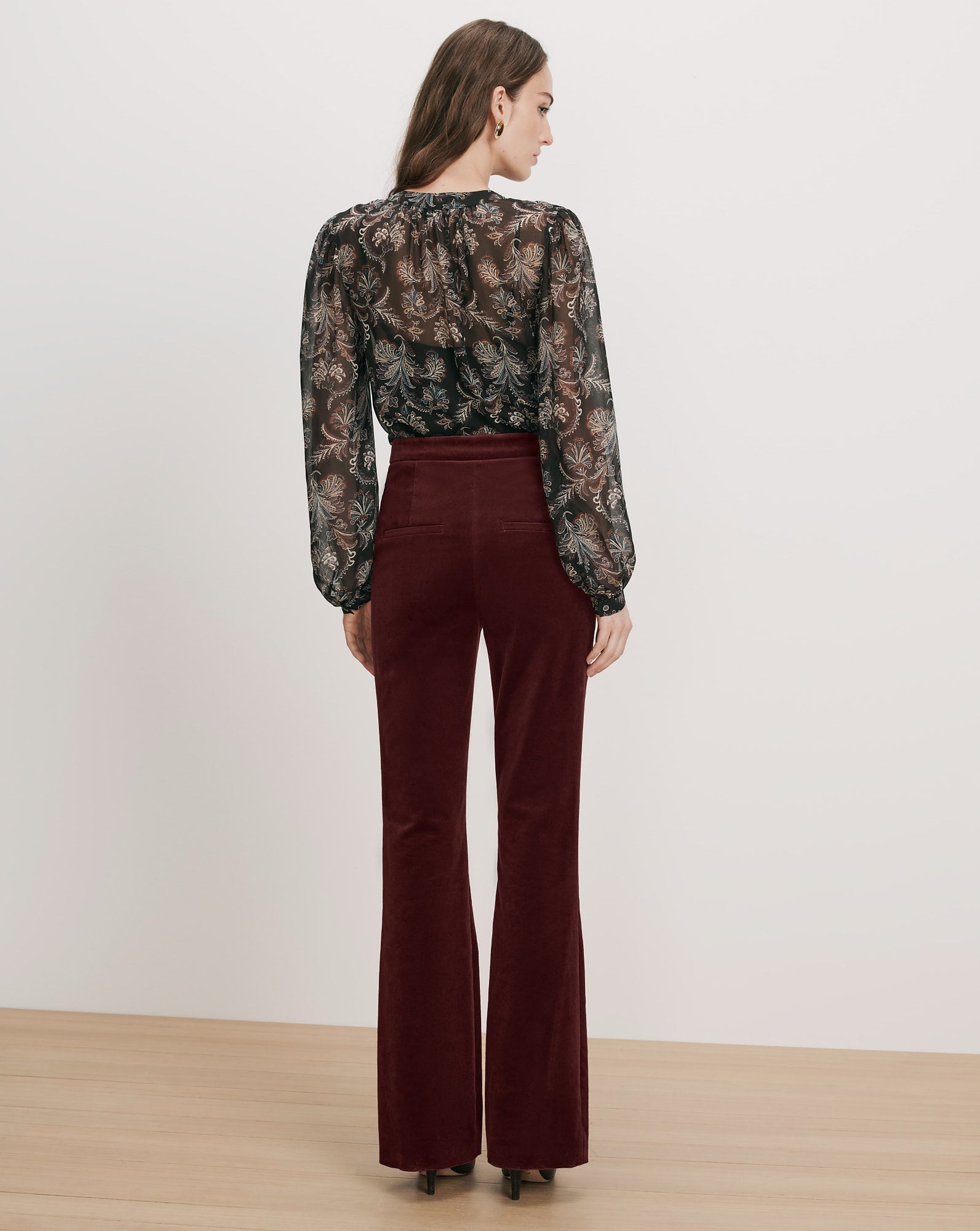 Veronica Beard Black floral sheer blouse, brown velvet flared pants.